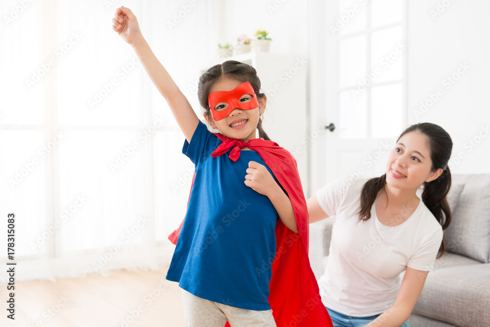 lovely little girl wearing superhero clothing