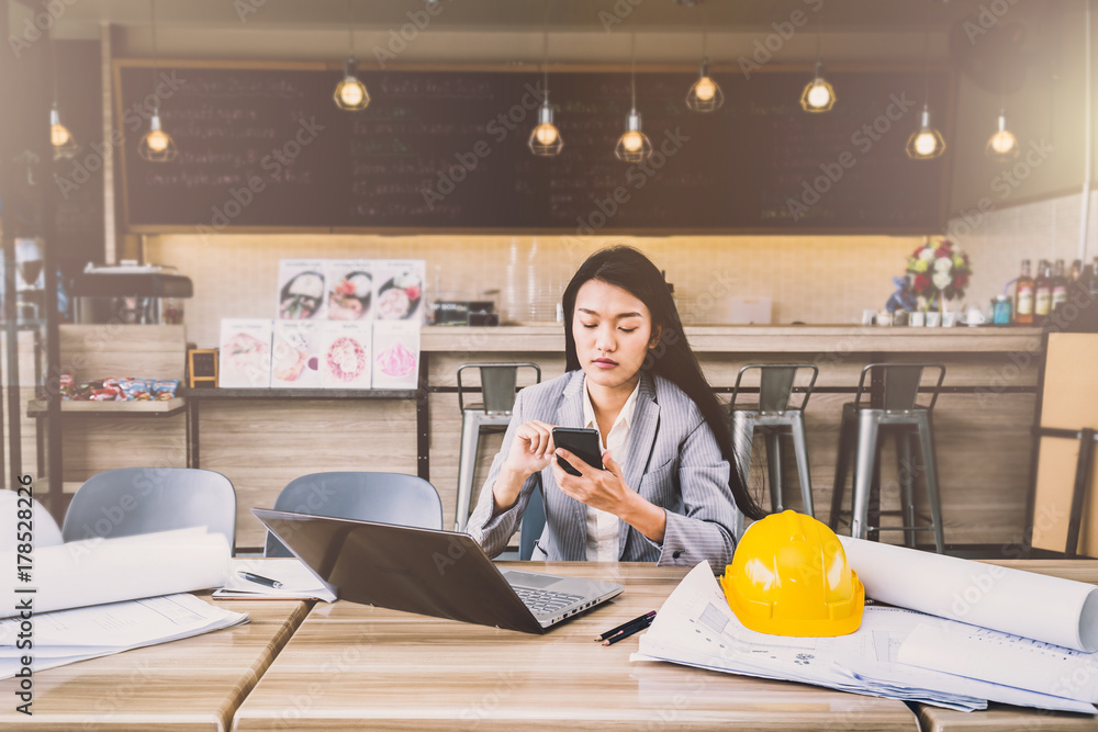 working business woman with laptop and coffee on wooden table outdoor location