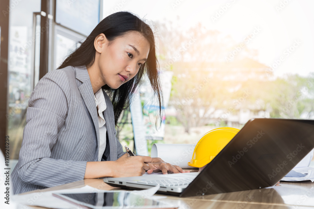 working business woman with laptop and coffee on wooden table outdoor location