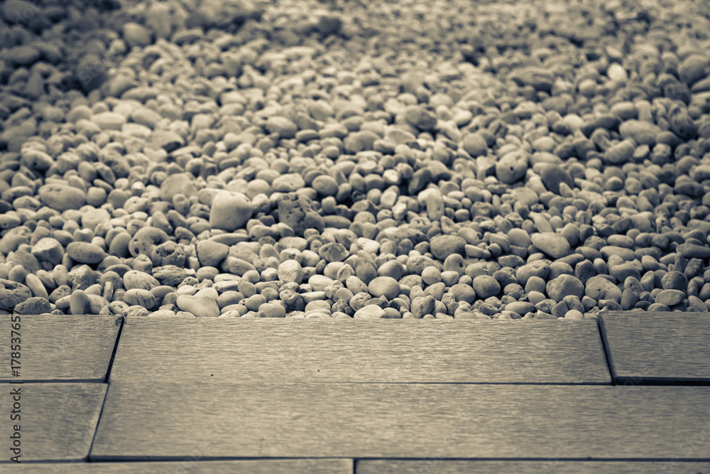 white pebble stone floor with sand stone pavement