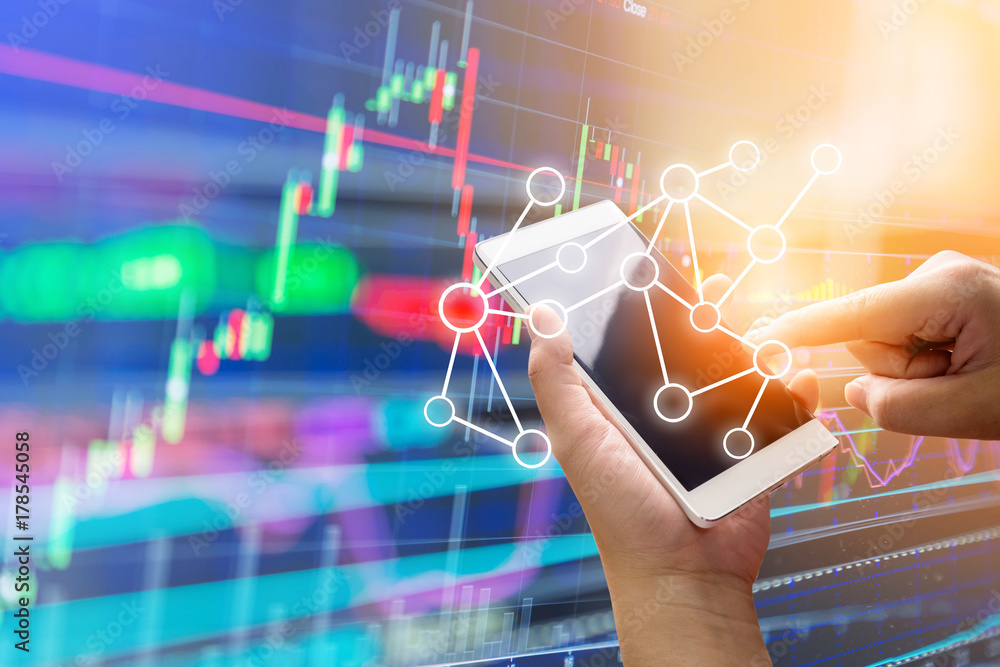 business connection concept with hand use smartphone with background of stock market chart analysis