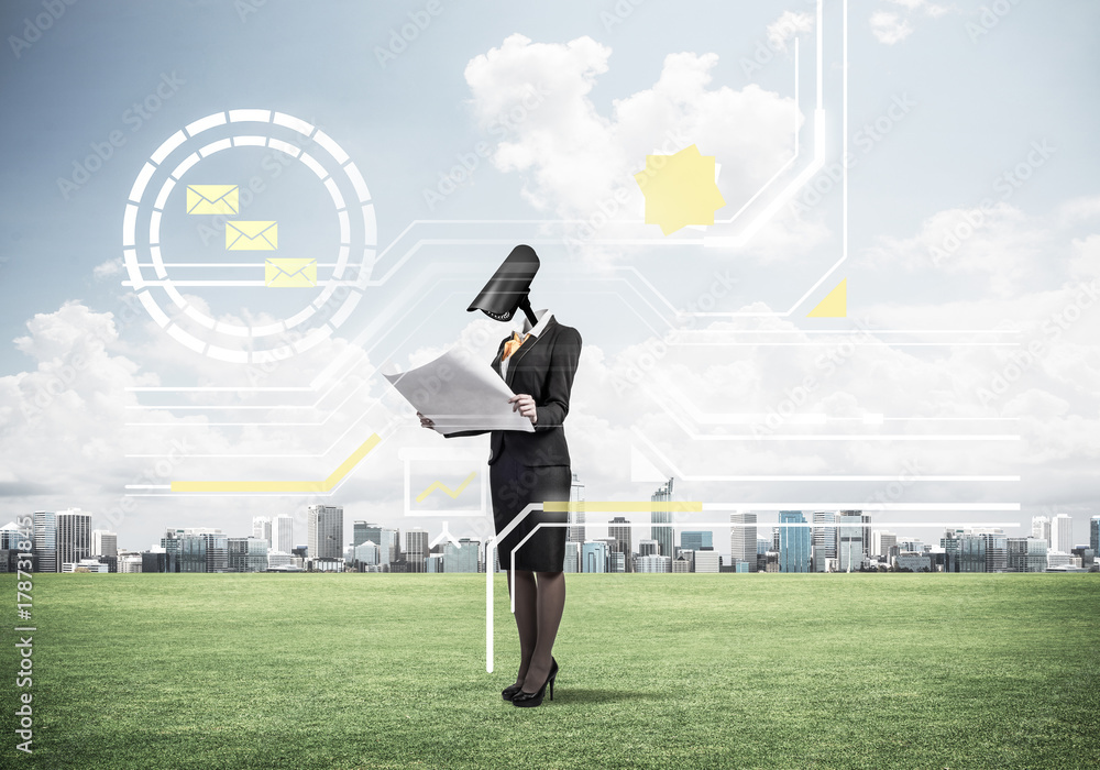 Camera headed woman standing on green grass against modern citys