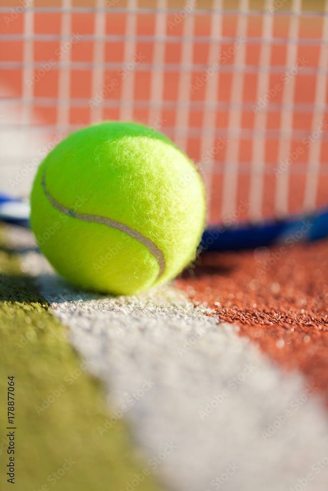 Tennis Racket and Ball on a Tennis Court