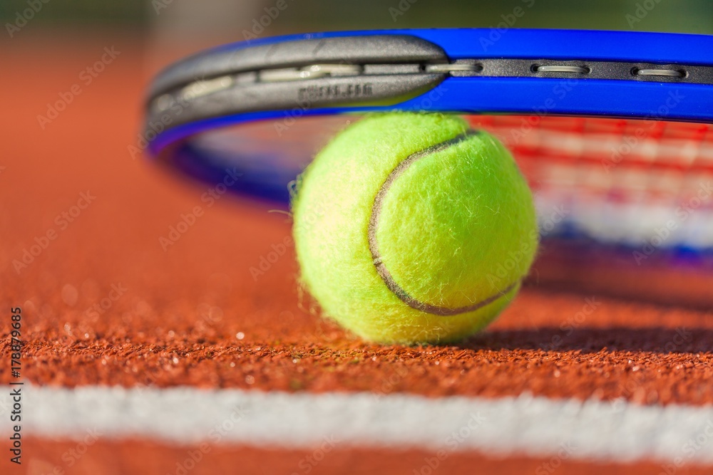 Tennis Racket and Ball on a Tennis Court