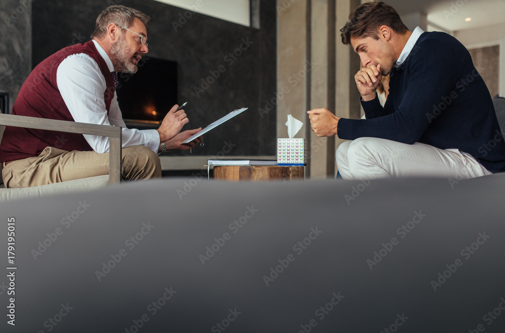 Couple having counseling session with psychologist