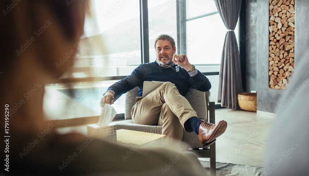 Psychologist advicing female patient