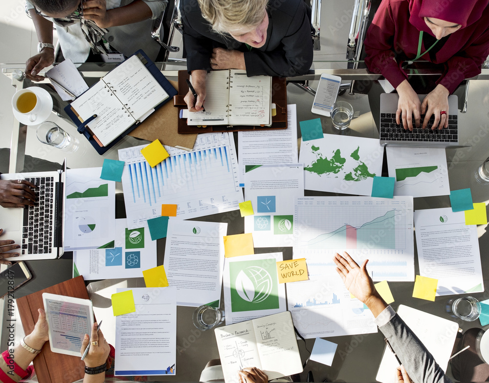 A Group of Business People in a Meeting about Environment