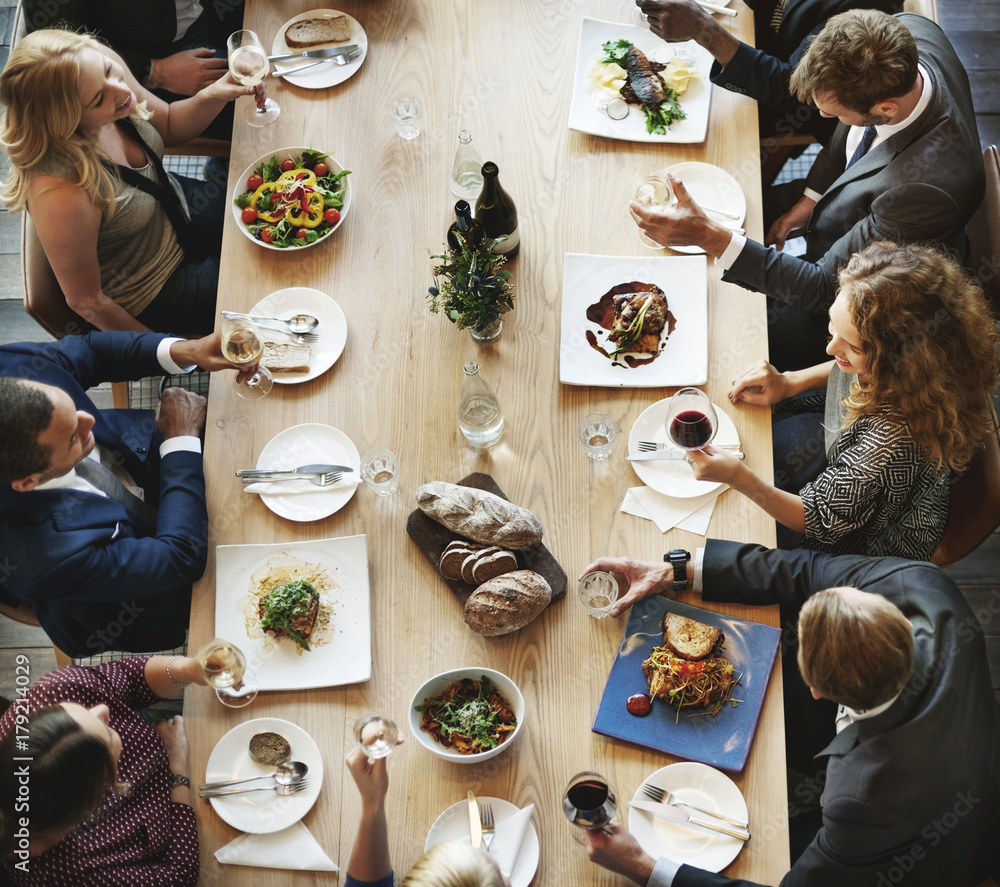 Group of diverse people are having lunch together