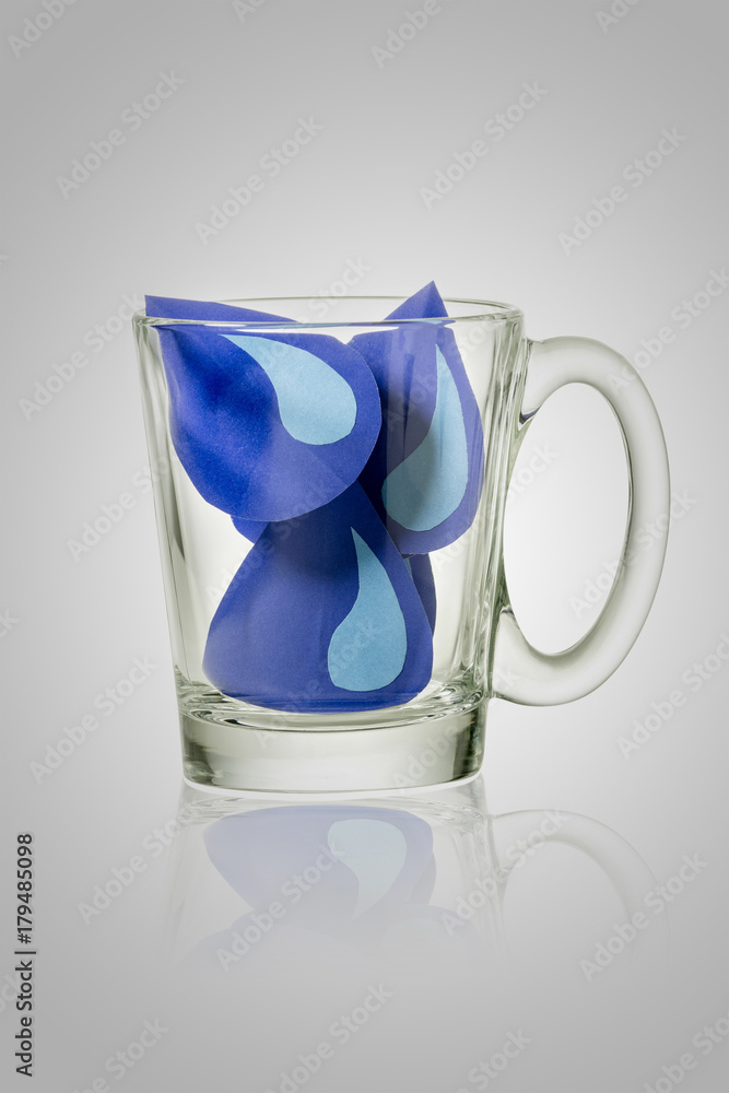 water drop paper cut in glass on gray background. File contains a clipping path.. Save water concept