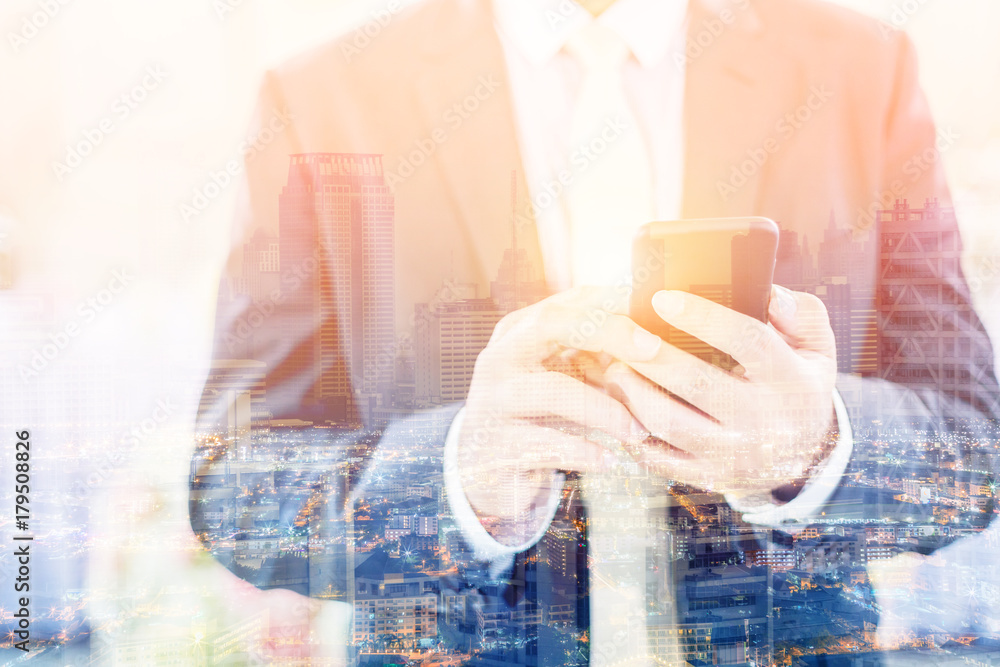 double exposure with image of businessman and cityscape night time with light flare effect business 