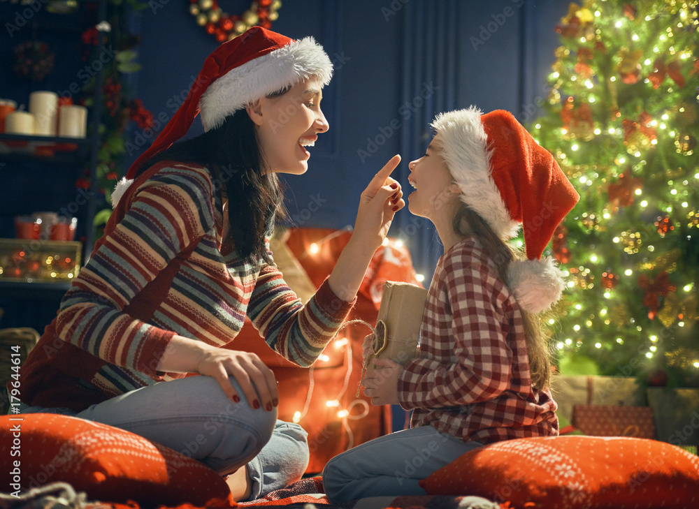 Mother and daughter exchanging gifts