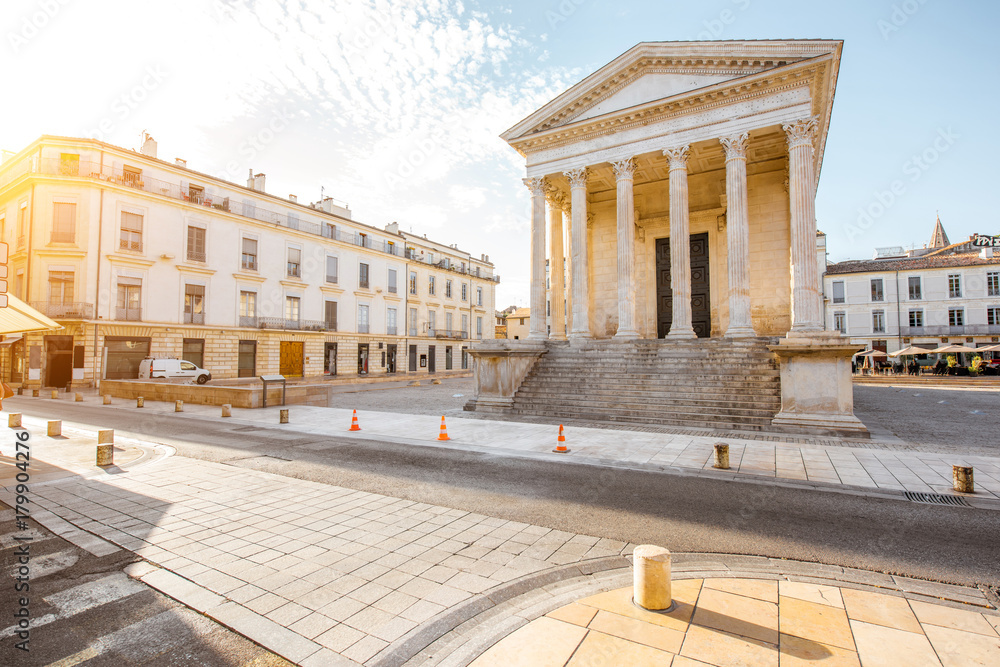 View on the ancient Roman temple Maison Carree during the sunny morning in Nimes in the Occitanie re