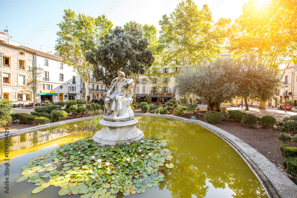 View on the small green fountain in Nimes city in the Occitanie region of southern France