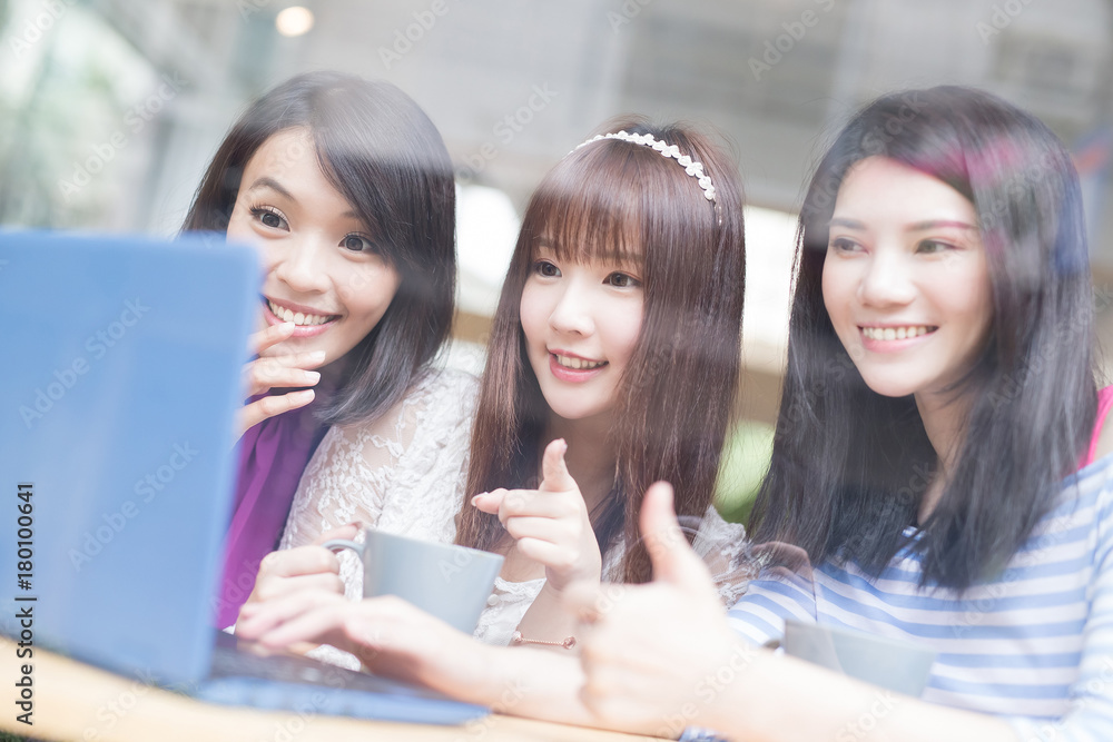 happy woman friends in restaurant