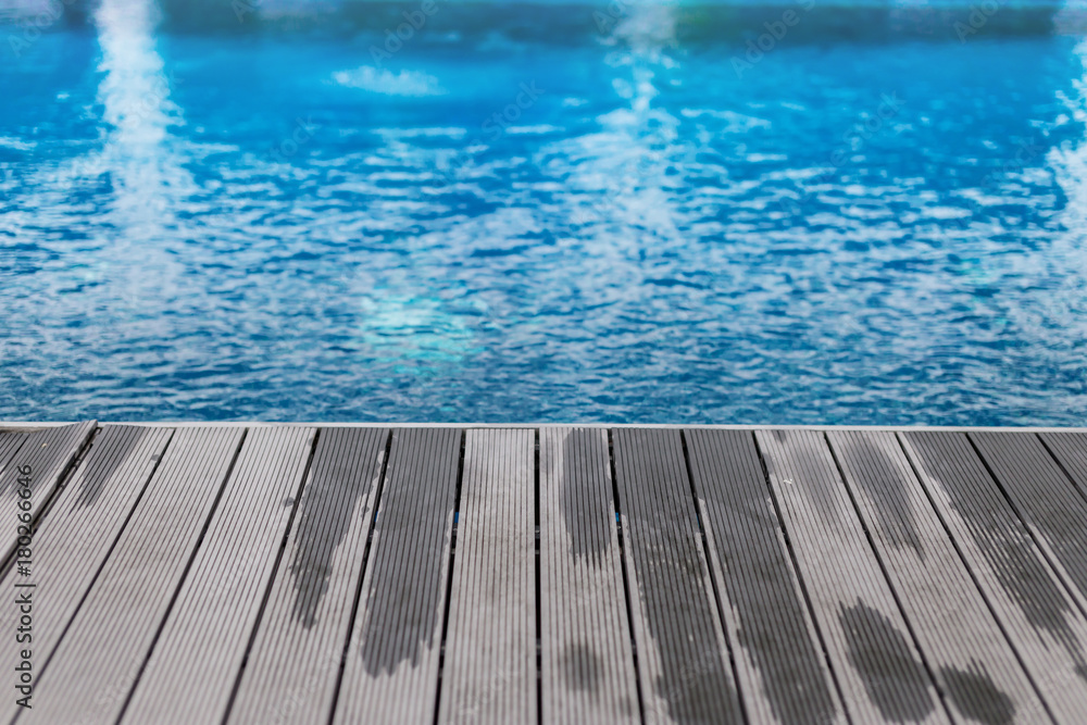 wooden deck with swimming pool side