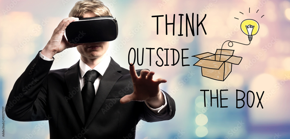 Think Outside The Box text with businessman using a virtual reality headset