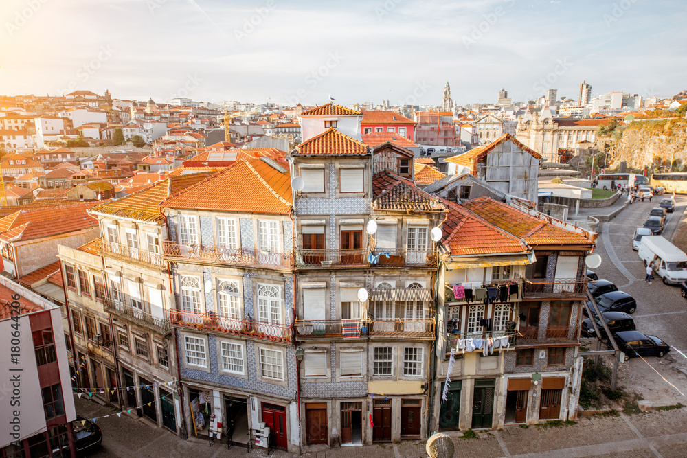 CItyscape view with beautiful old buildings during the sunset light in Porto city, Portugal