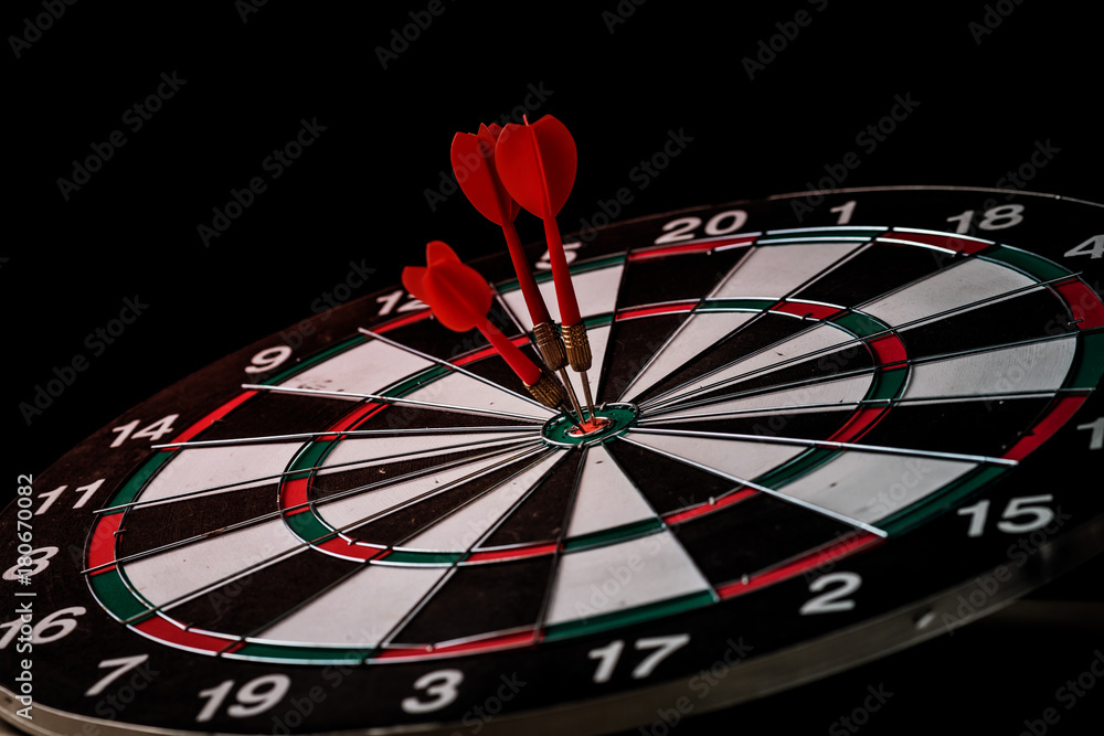 Red dart arrow hitting in the target BUSINESS STRATEGY IDEAS CONCEPT