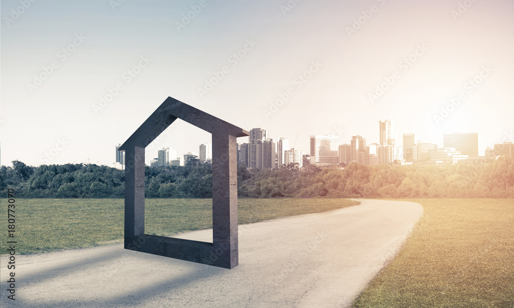 Conceptual background image of concrete home sign on asphalt roa