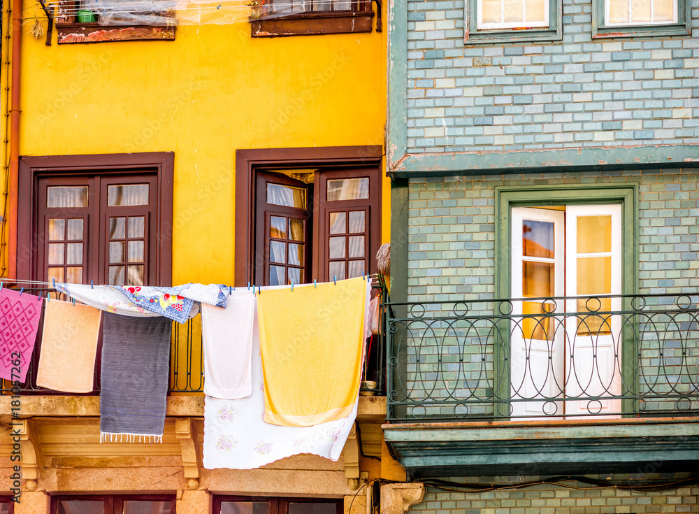 Cothes drying on the windows of the old buildings in Porto city, Portugal