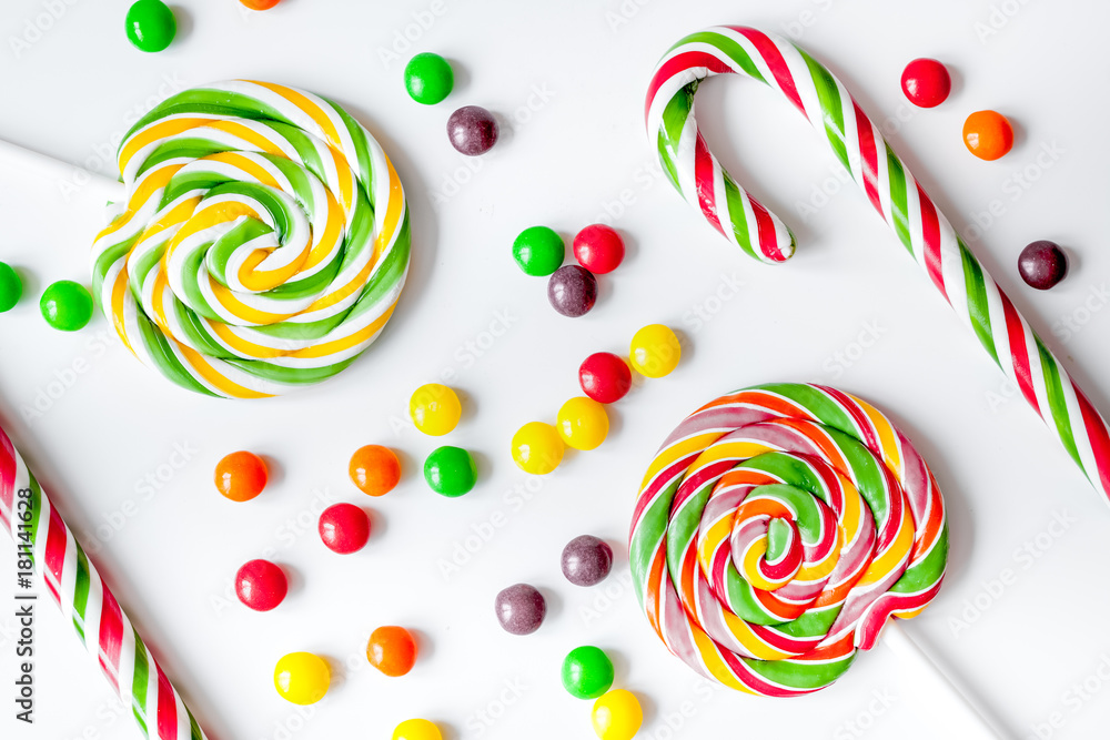 sweets and sugar candies on white background top view