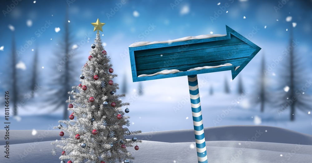 Wooden signpost in Christmas Winter landscape with Christmas