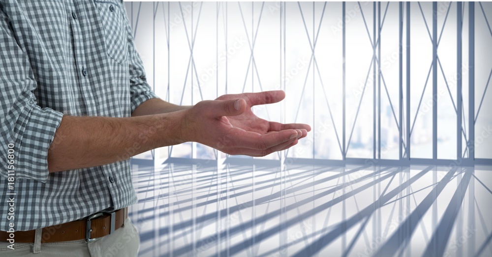 Businessman with hands palm open in city office