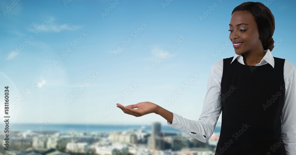 Businesswoman with hands palm open in city