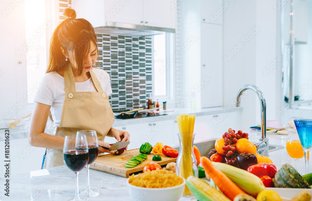 Asian teen couple are helping to make dinner. And bakery together happily. On Valentines Day in the