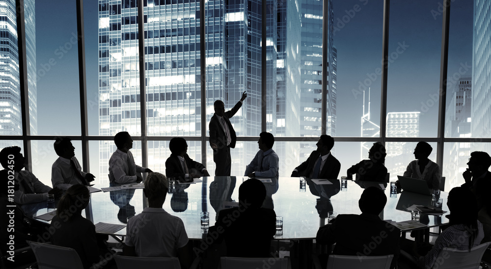 Business people in a board room meeting