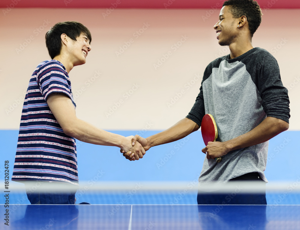 Table tennis players shaking hands