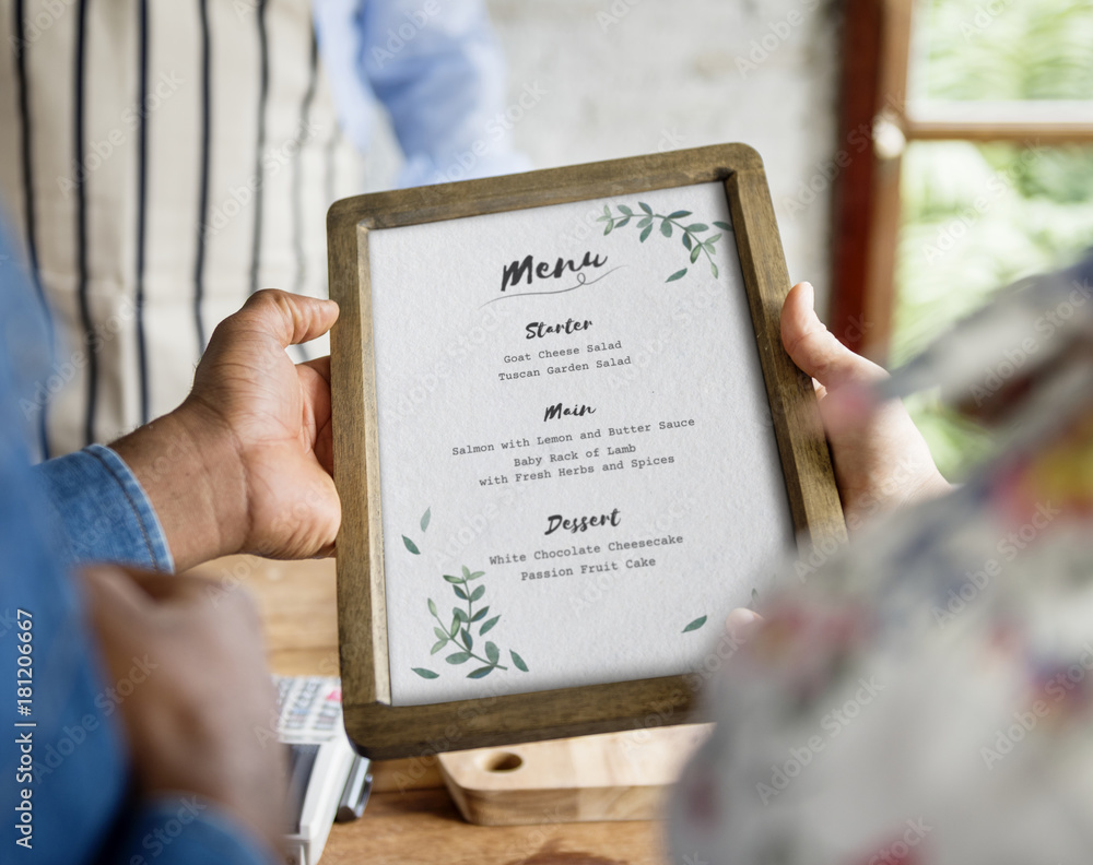 Closeup of people hands holding menu list