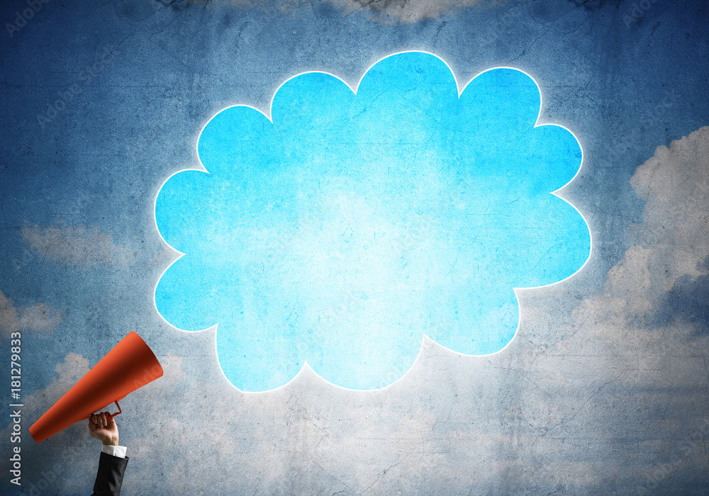 Hand of businesswoman holding red paper trumpet and speech cloud