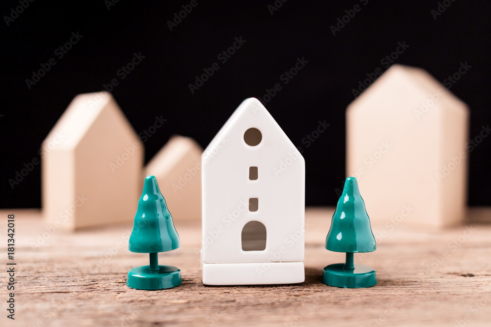 home design and building concept with house paper model on texture background