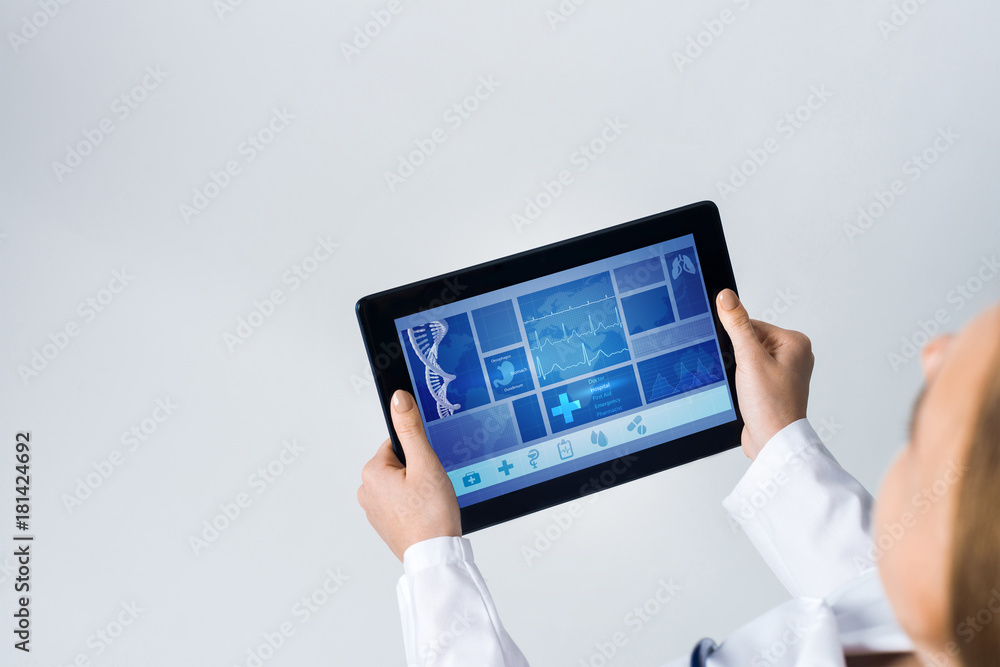 Close of female doctor hands working with tablet pc computer