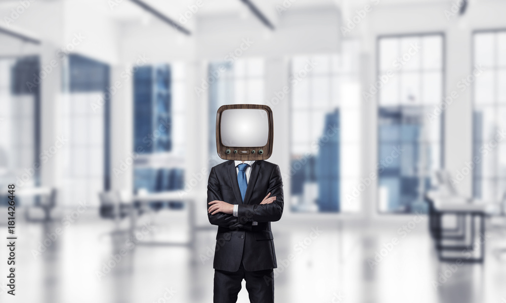 Businessman with old TV instead of head.