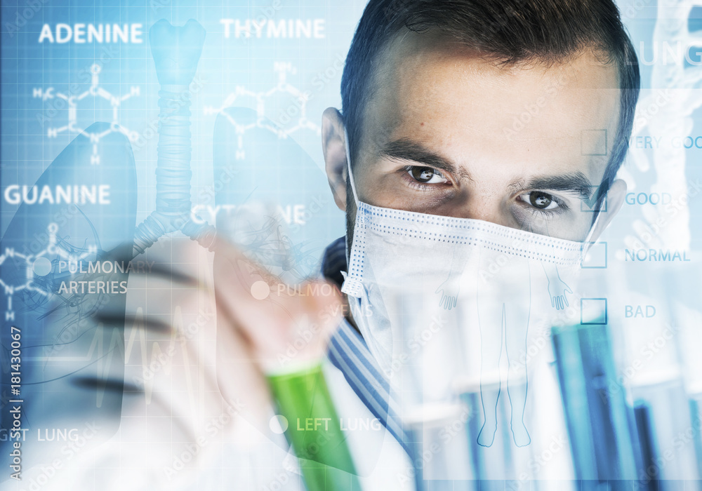 Young scientist mixing reagents in glass flask in clinical laboratory