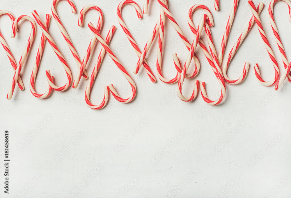 Christmas holiday red candy cane pattern, texture and background on white background, flat-lay, copy