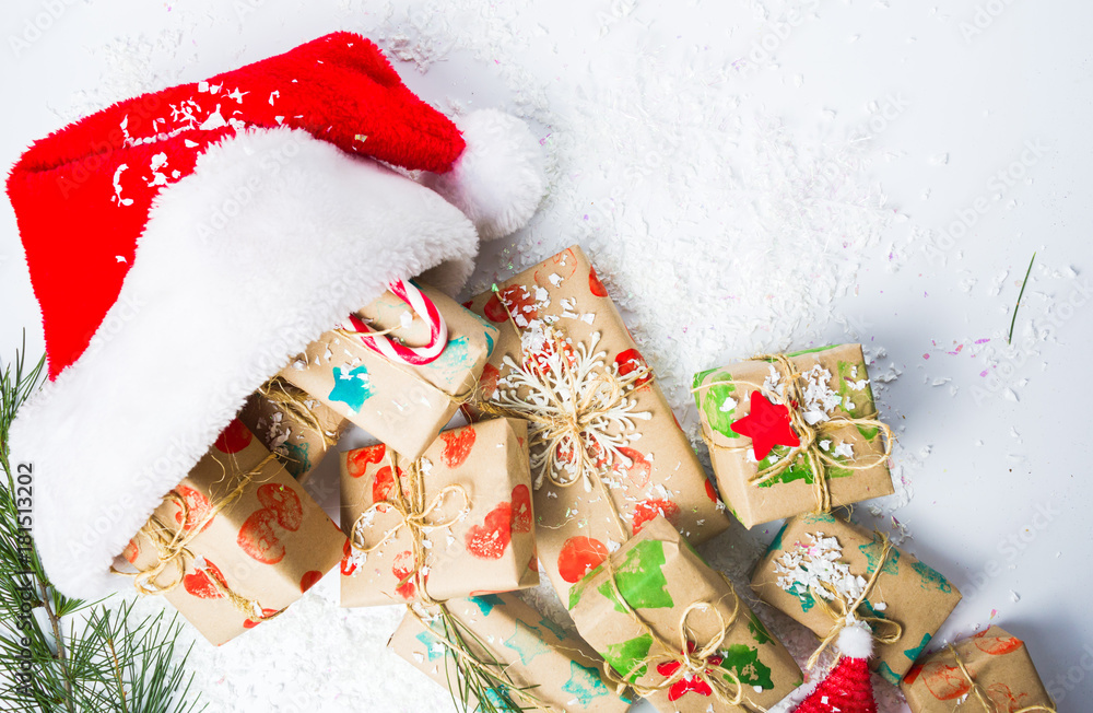 Bunch of Christmas presents and Santa hat