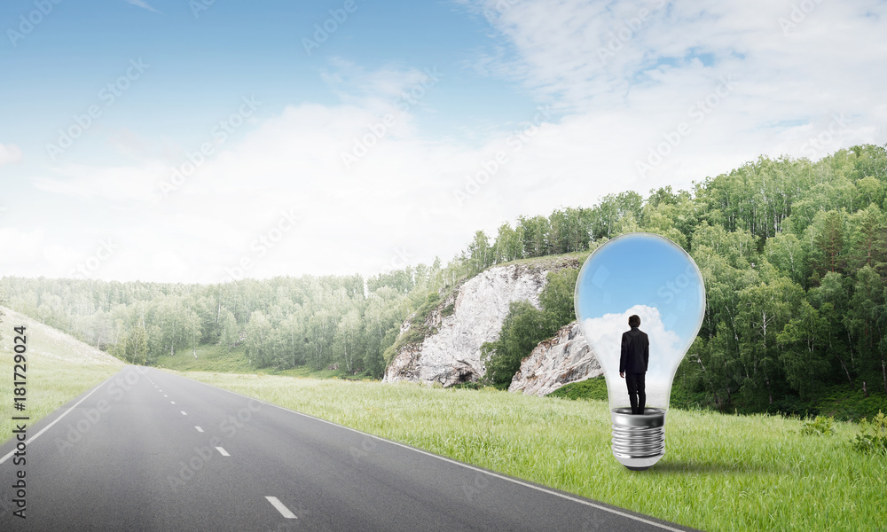 Businessman inside light bulb