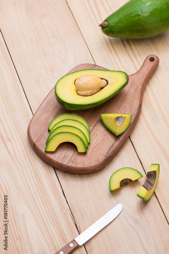 Healthy food concept. Fresh organic avocado on table