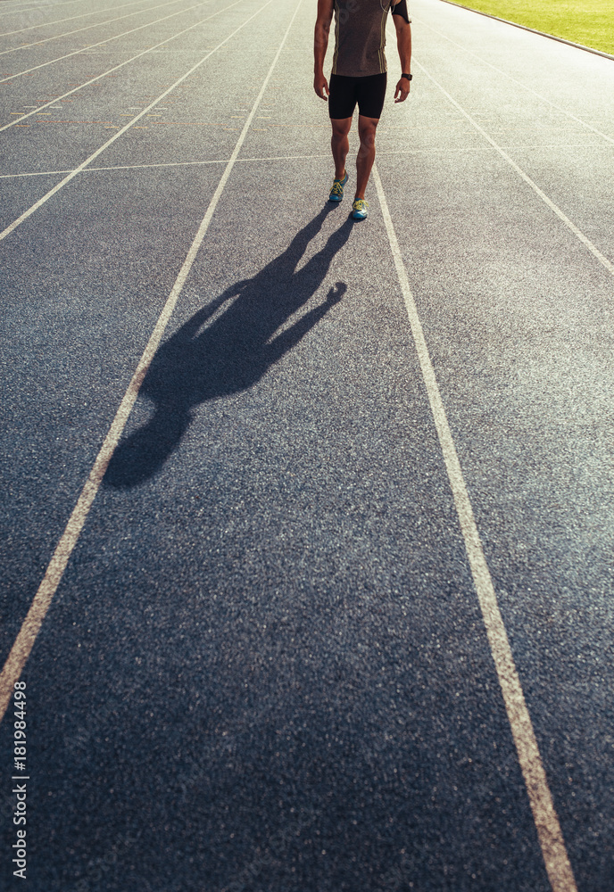 Sprinter walking on running track