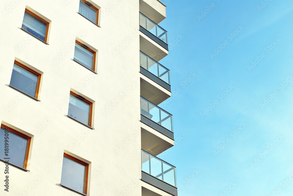 Modern apartment buildings on a sunny day with a blue sky. Facade of a modern apartment building