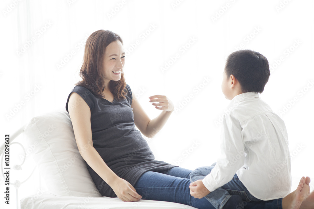 A boy who talks with a pregnant mother