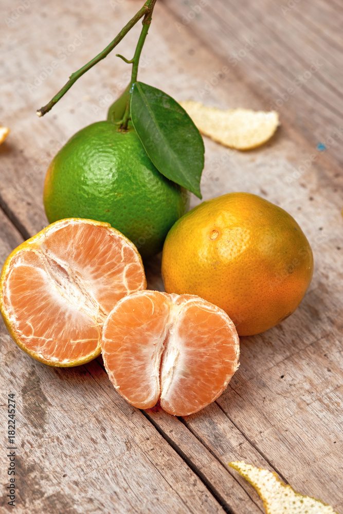 Mandarins. Fresh tangerines on a wooden background