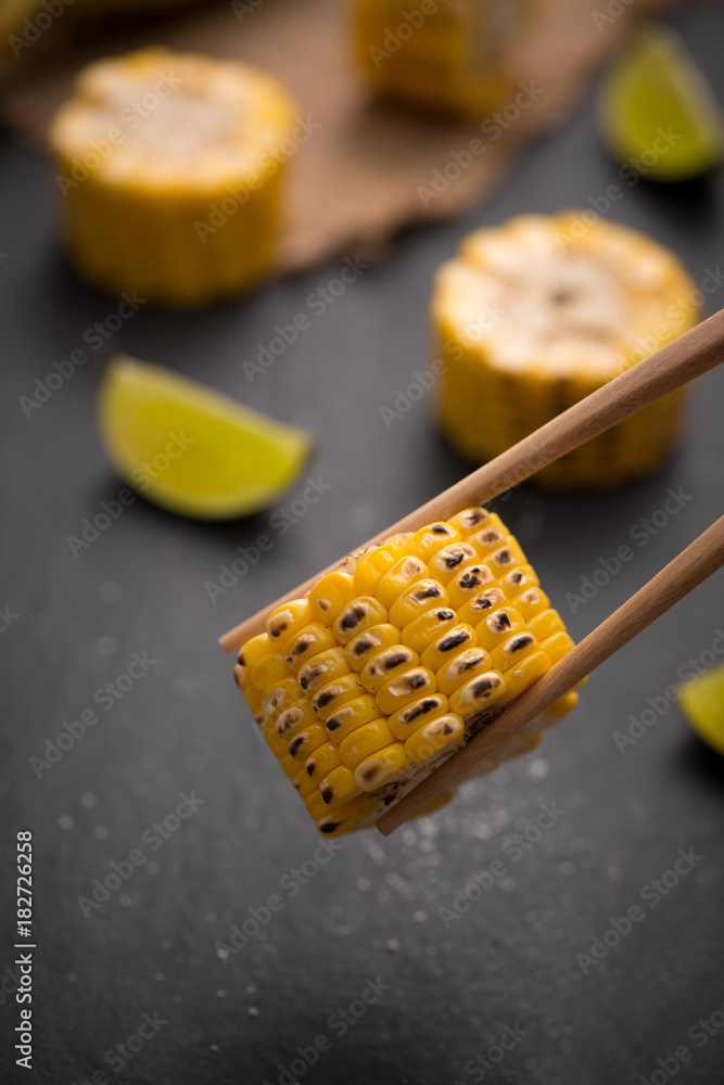 Tasty sweet grilled corn with salt and lime.