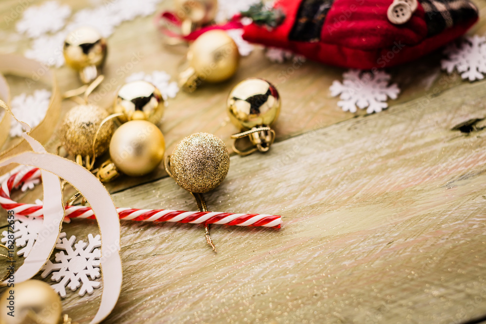 festive background concept with christmas decorating items on wooden background with light filter