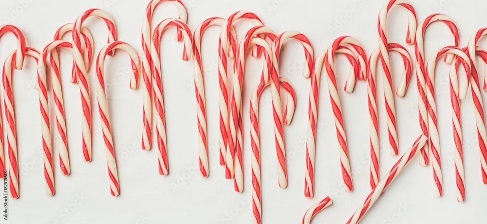 Christmas holiday red striped candy cane pattern, texture and background on white, top view, flat-la