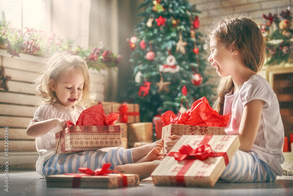 girls opening gifts