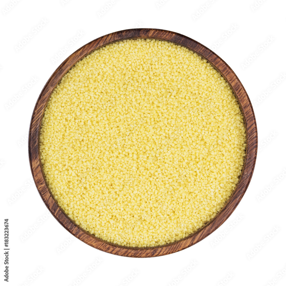 Couscous in wooden bowl isolated on white background, top view